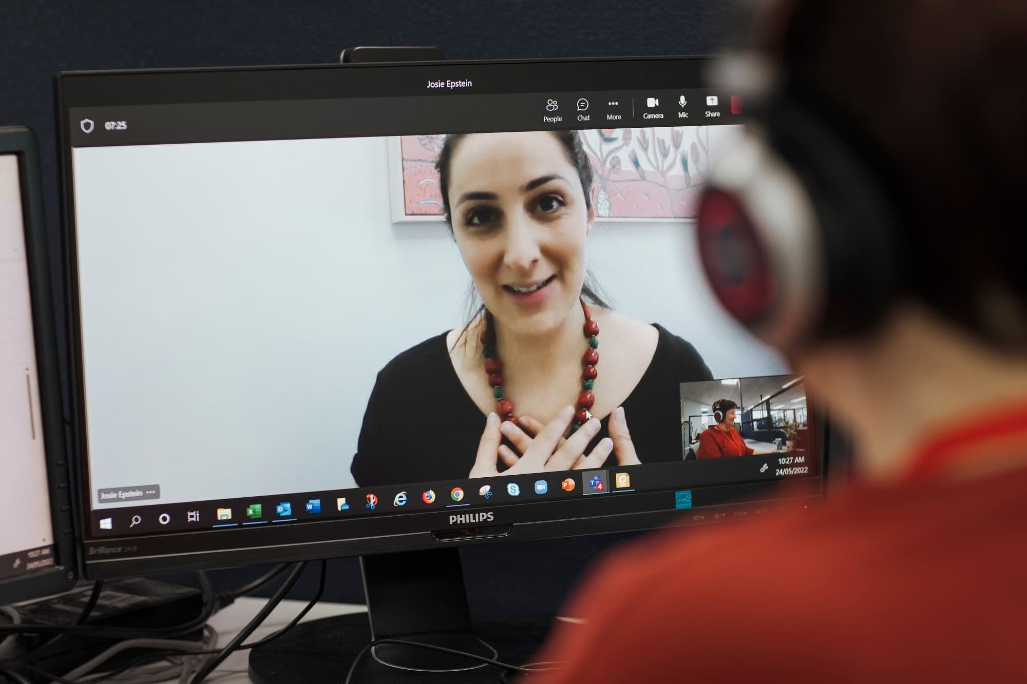 An MS Plus nurse speaking to a client over video all.