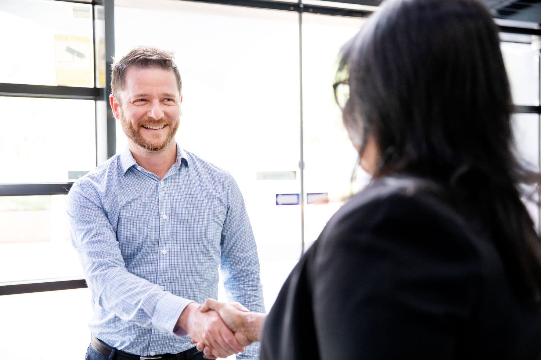 person in blue shirt smiling