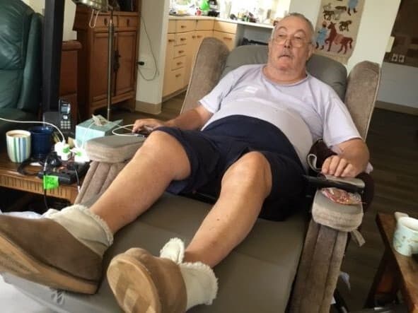 Stuart reclining in a chair b