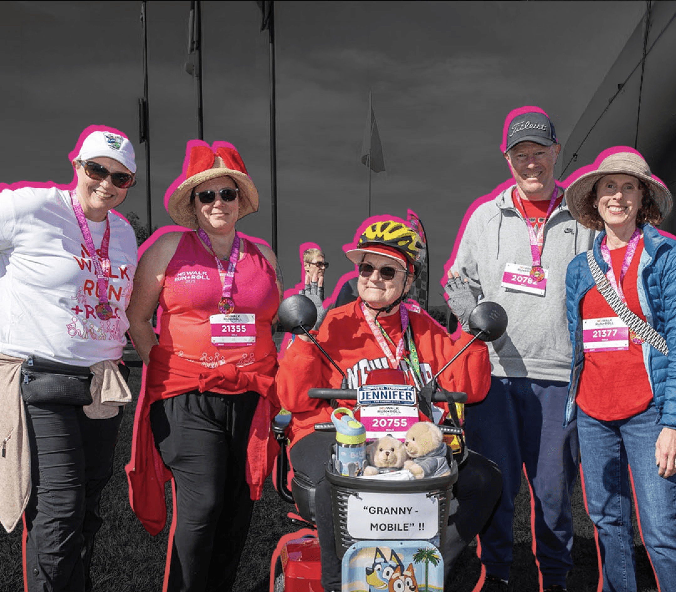Group of people dressed up in fancy dress standing together smiling at the Walk Run Roll event