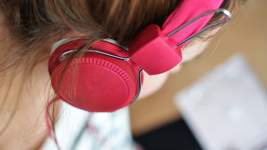 Closeup of person listening to headphones