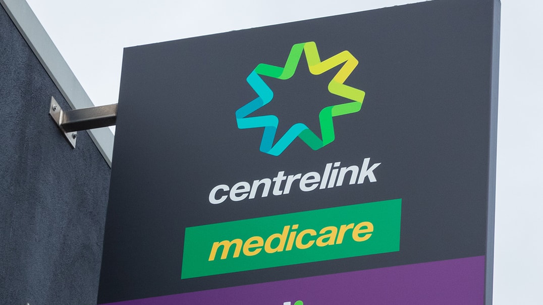 Exterior shot of a sign that reads centrelink and ndis