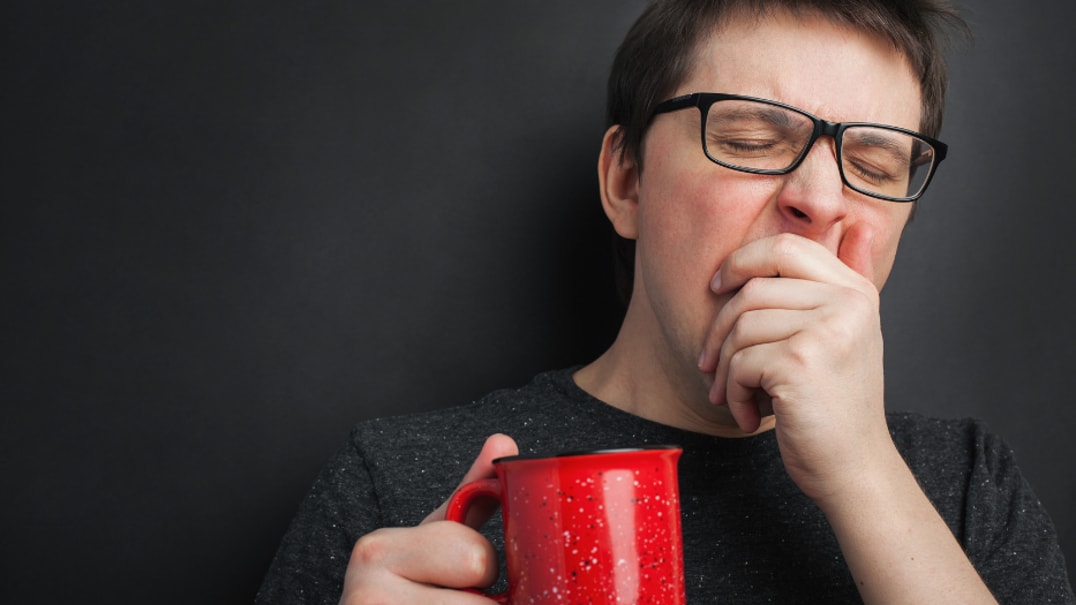 Person carrying a mug sleeping