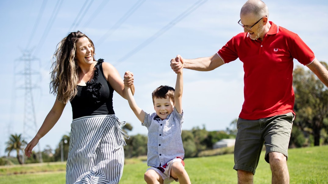 Young family playing outside